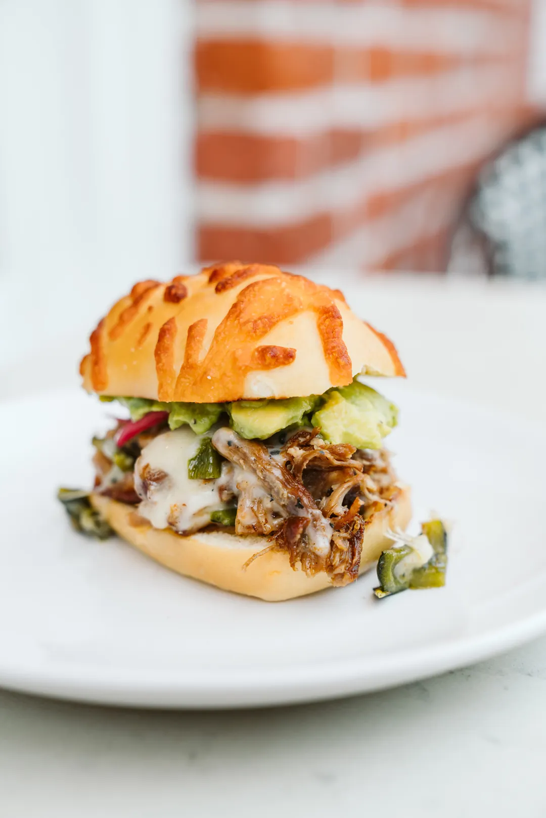 Carnitas slider on a Jay’s cheese roll