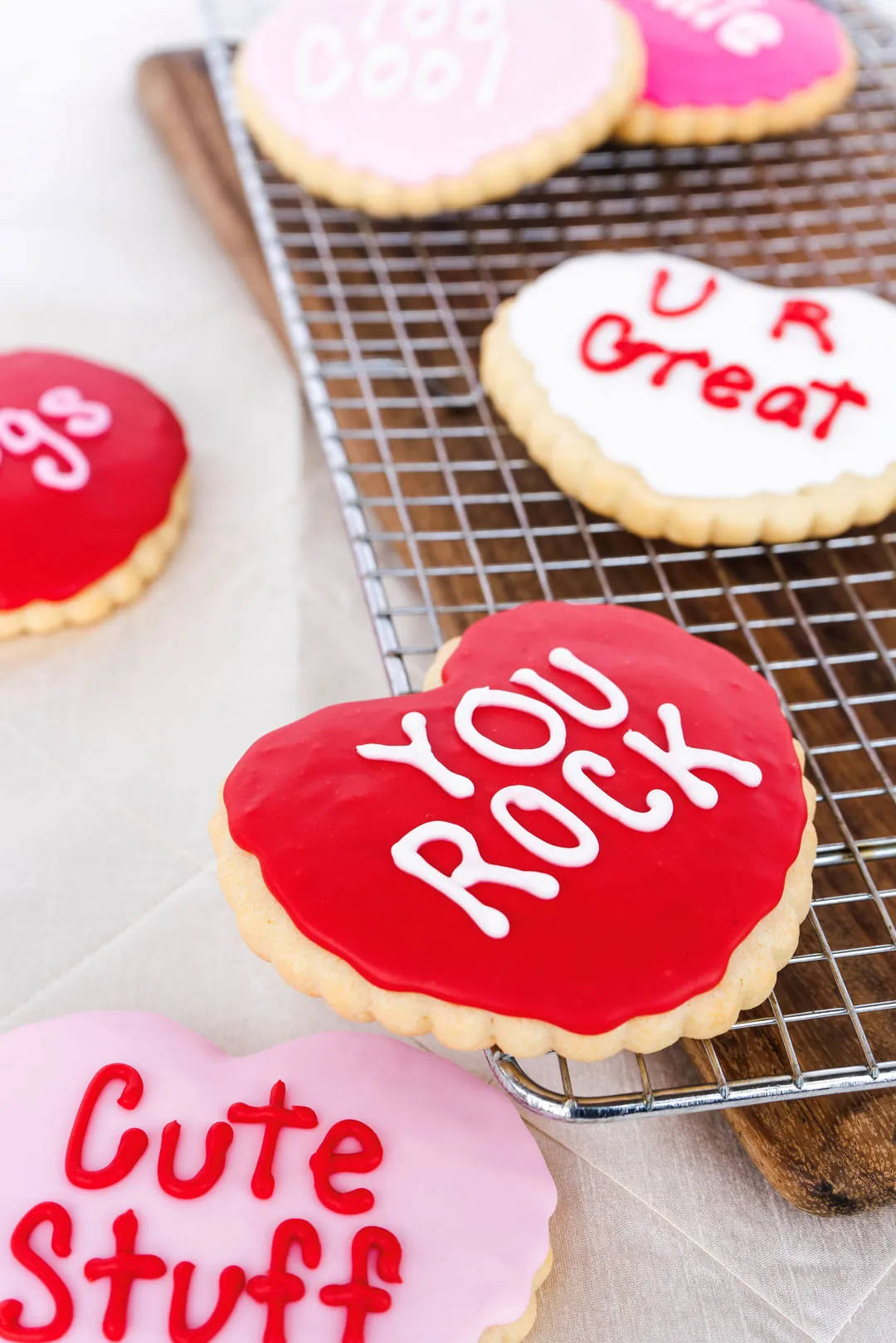 Conversation heart cookies reading Cute Stuff, You Rock, and U R Great