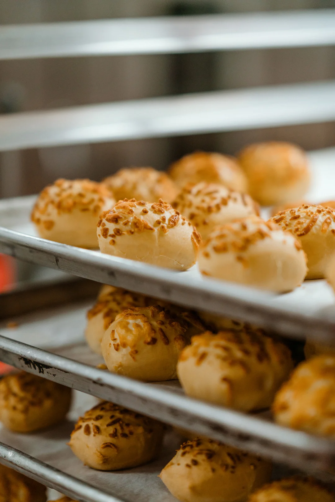 Trays of freshly baked cheese rolls