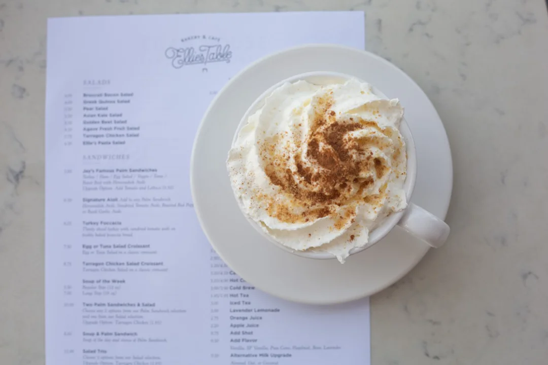 Pumpkin pie latte topped with whipped cream, graham cracker crumbs, and cinnamon