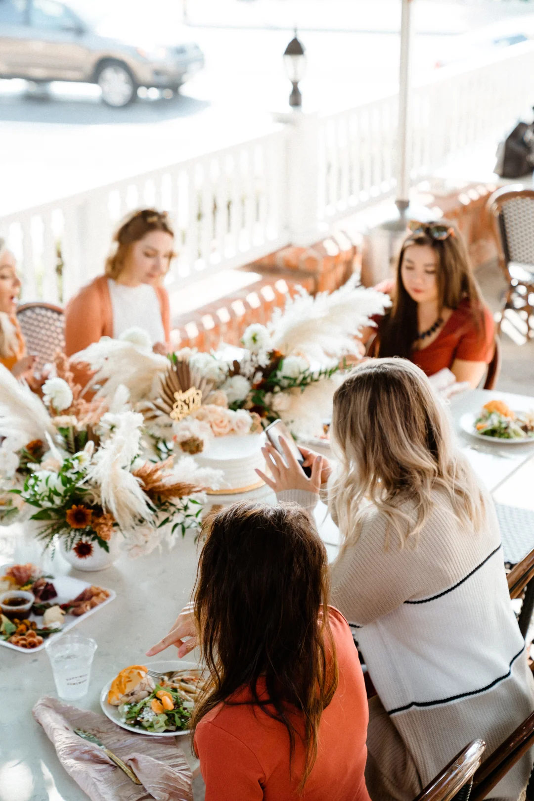 Friends sharing lunch at the outdoor table