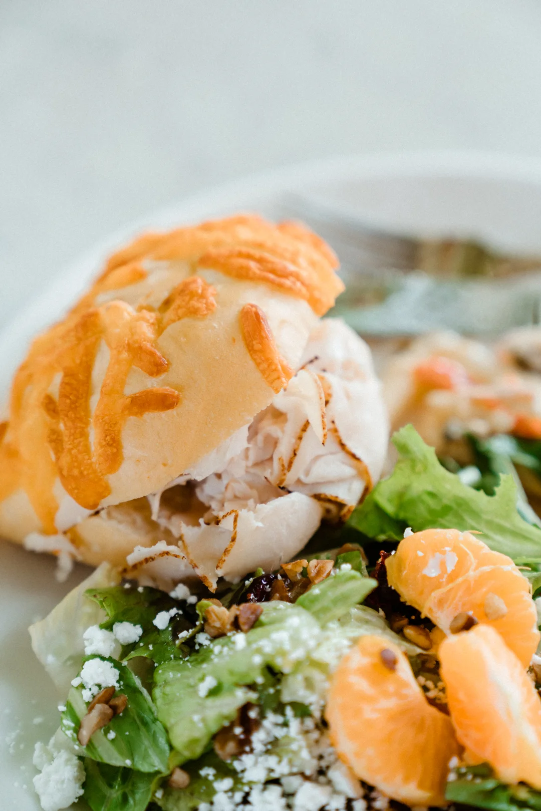 Close view of a sandwich served with salad