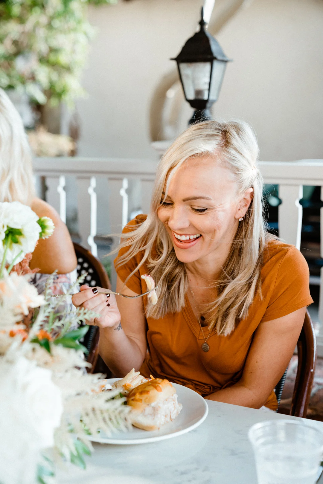 Woman enjoying lunch at the outdoor table