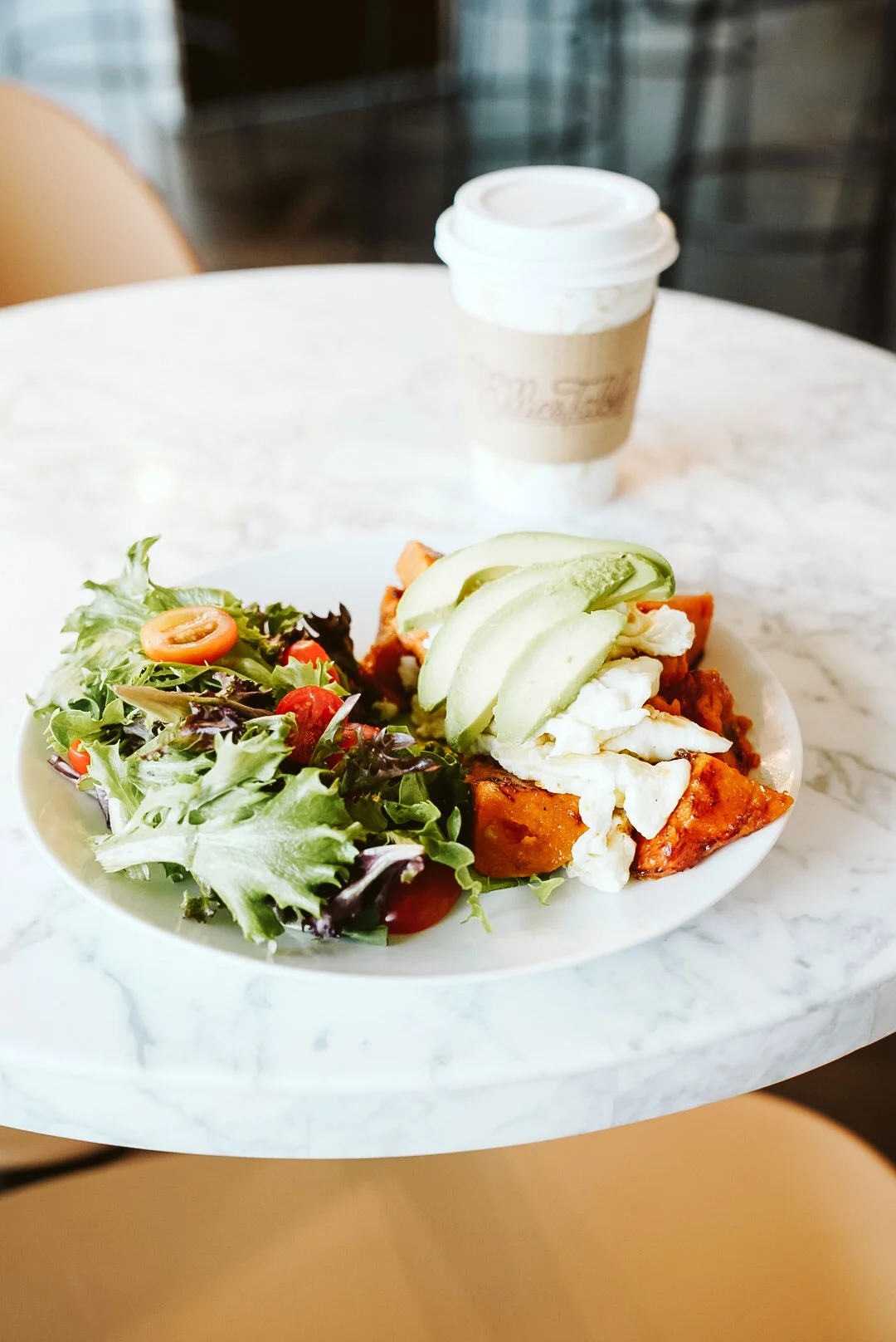 Egg white breakfast bowl with sweet potatoes, avocado, and mixed greens