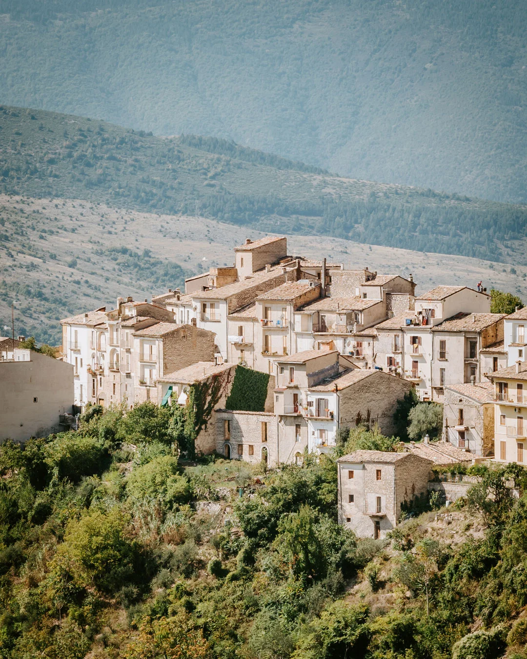 Stone homes of Pacentro on a green hillside