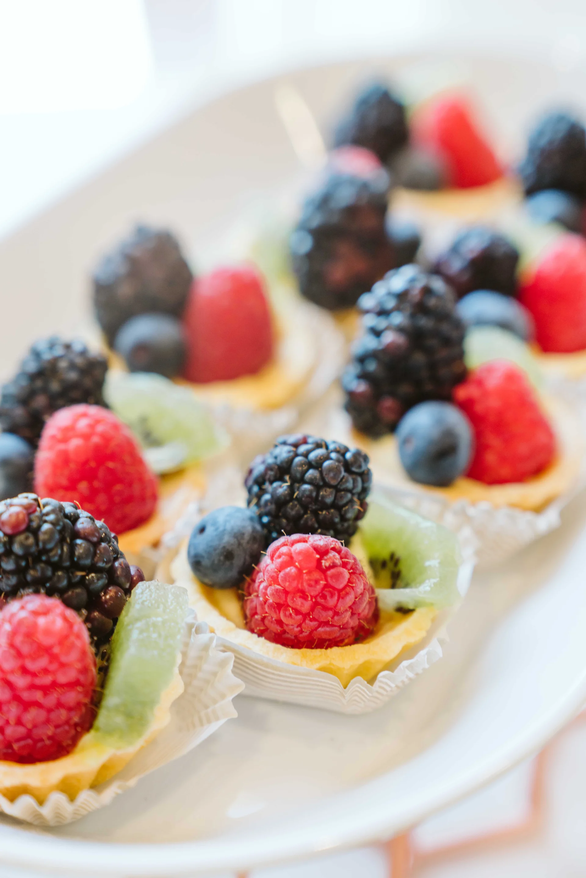Fruit tart topped with strawberries, raspberries, and blackberries