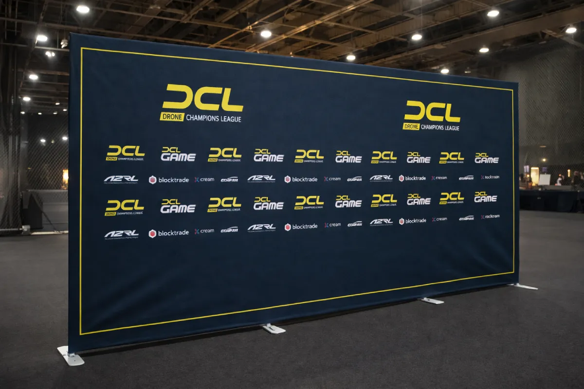 Glare-free fabric tension backdrop and event branding for the Drone Champions League (DCL) AI Grand Prix in Abu Dhabi.