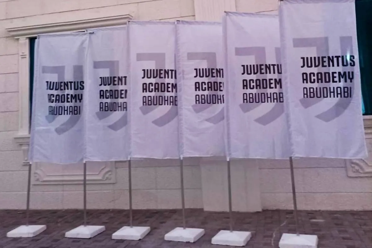 Custom printed flags for the Polygreen 'Again, Please' sustainable initiative at Yas Marina Circuit during the Abu Dhabi Grand Prix.