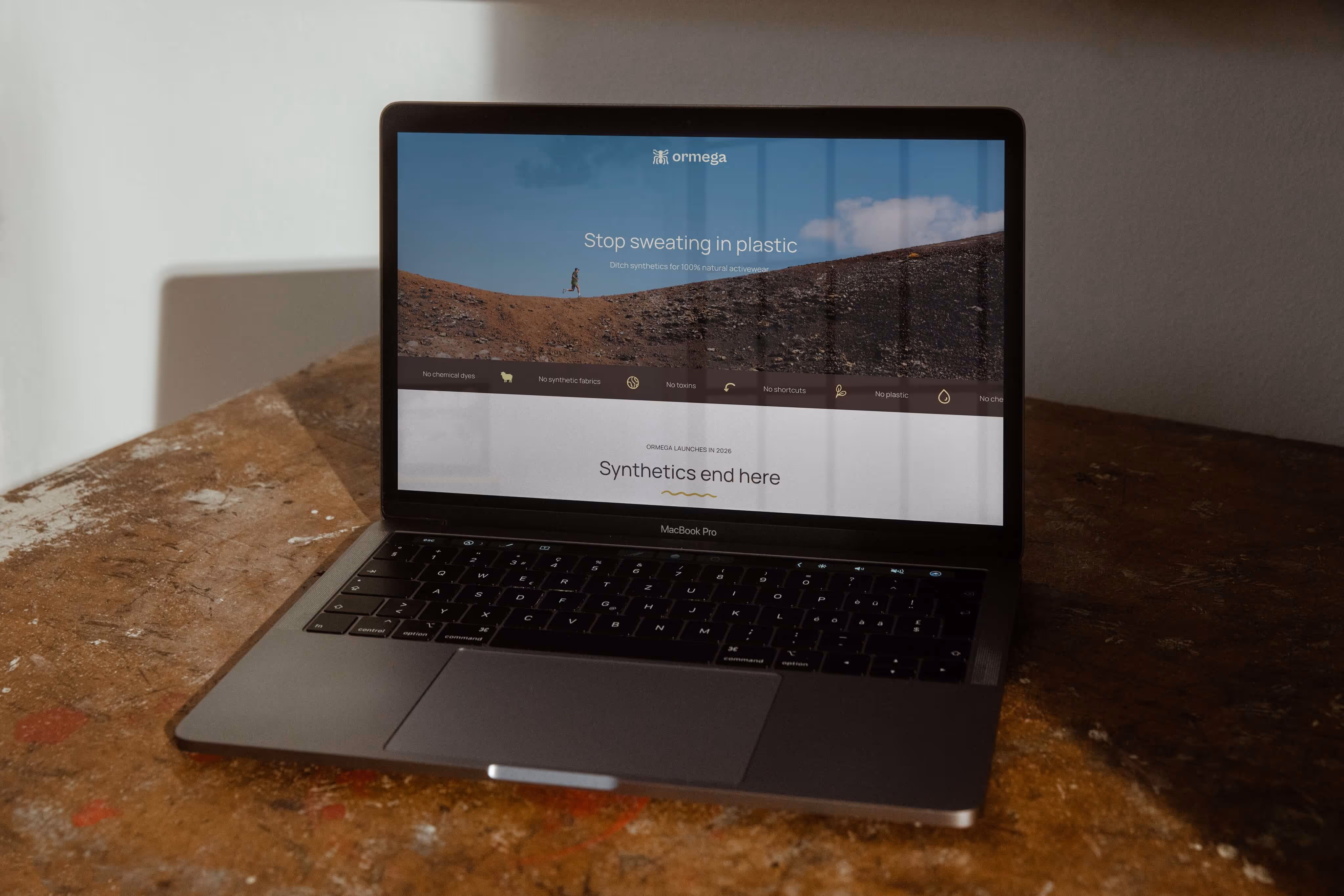 Ormega home page Web Design on laptop