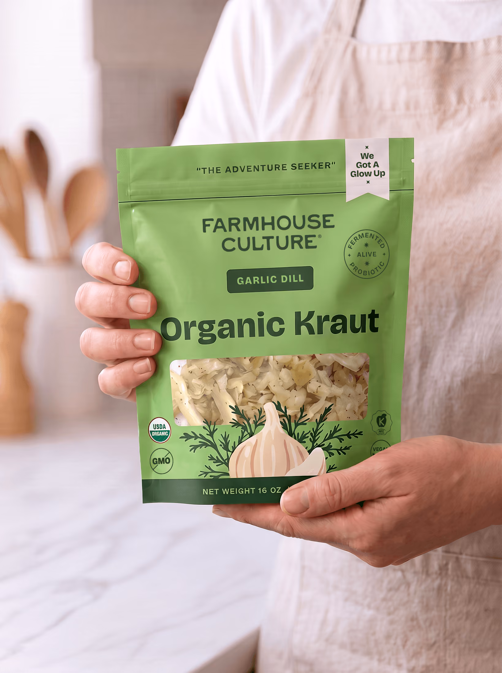 Farmhouse Culture organic garlic dill kraut pouch packaging in hands