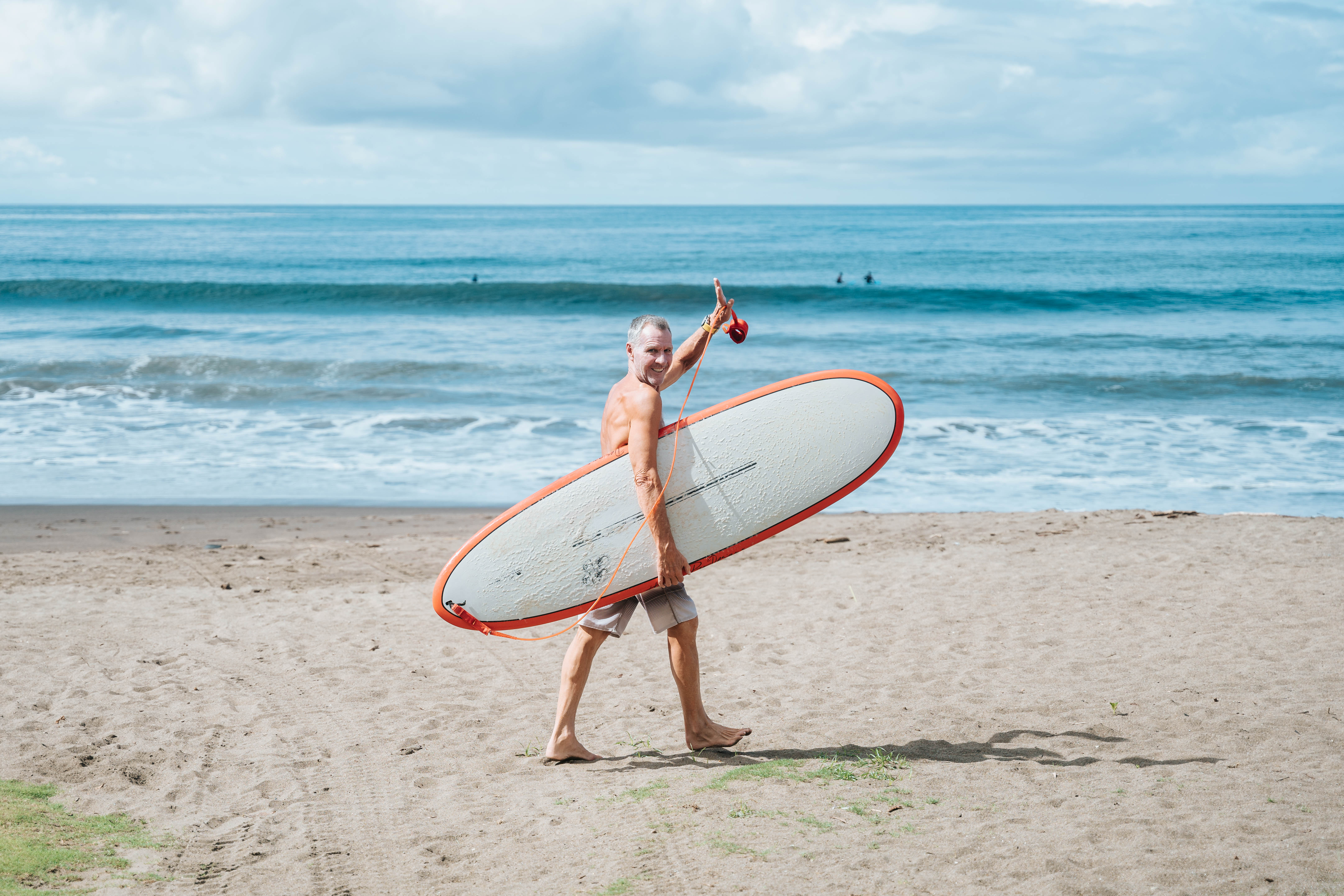 Surfer walking on the beach