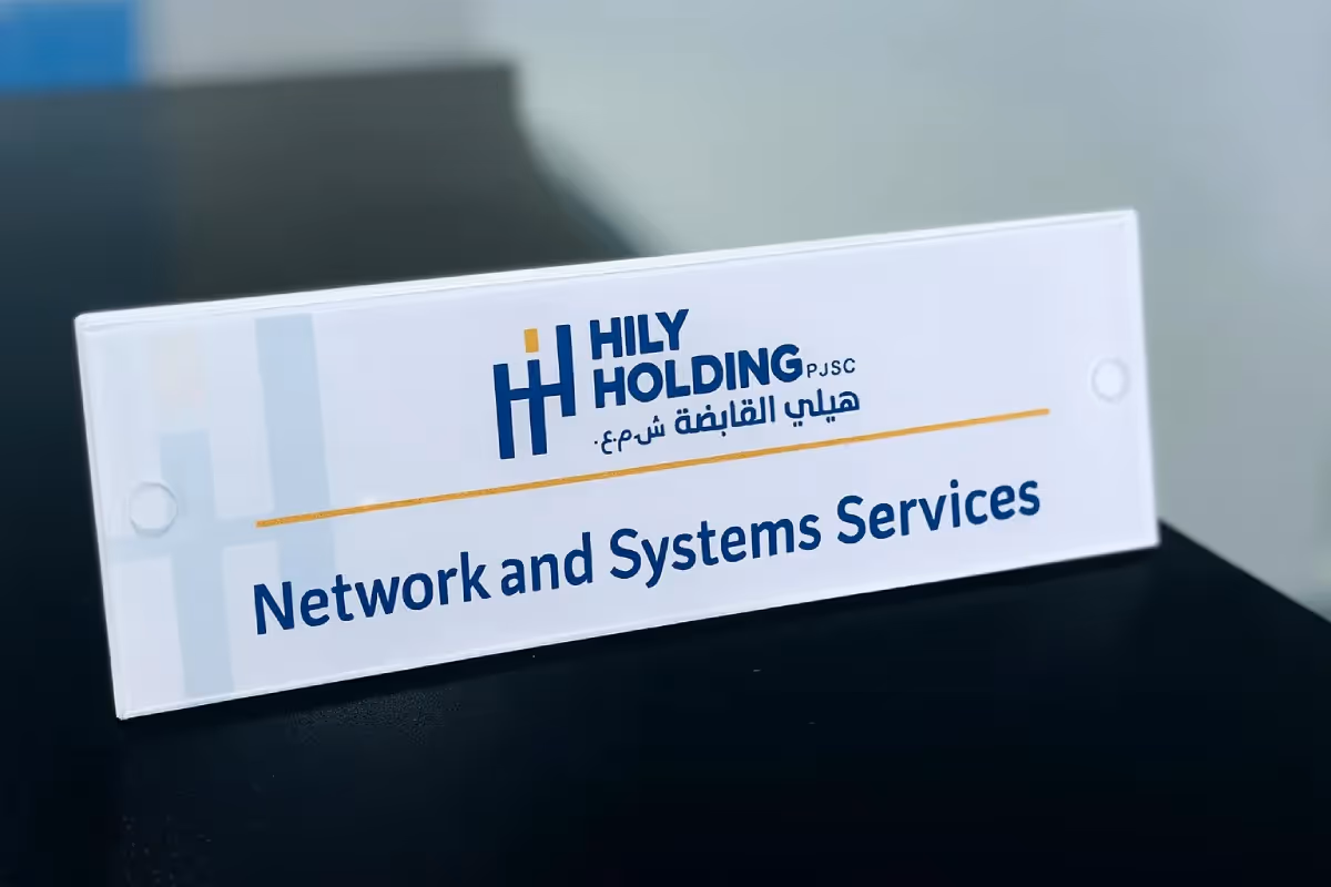 Reverse-printed acrylic door identification signs mounted with silver stainless steel mirror-finish spacers for corporate office wayfinding system