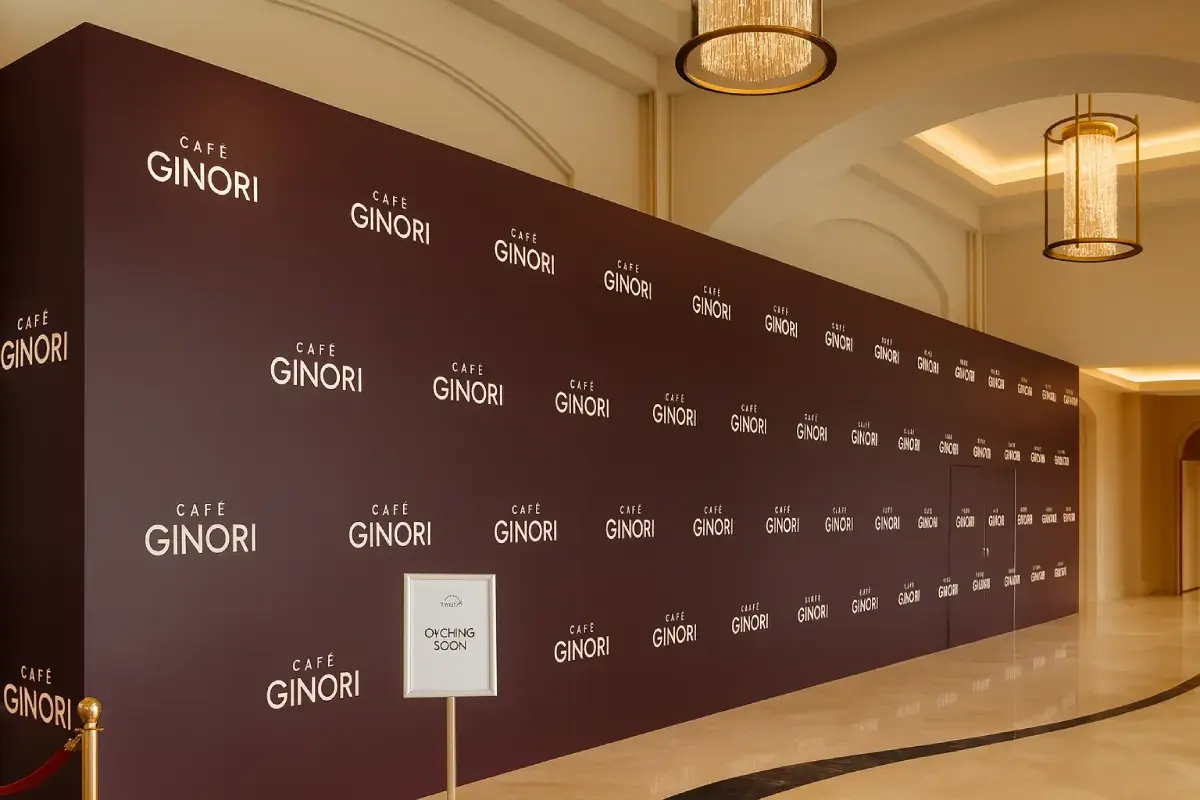 Café Ginori 77 sqm hoarding barrier graphics for St. Regis Saadiyat Island cafe construction with HP Latex thermal printing on matte banner vinyl