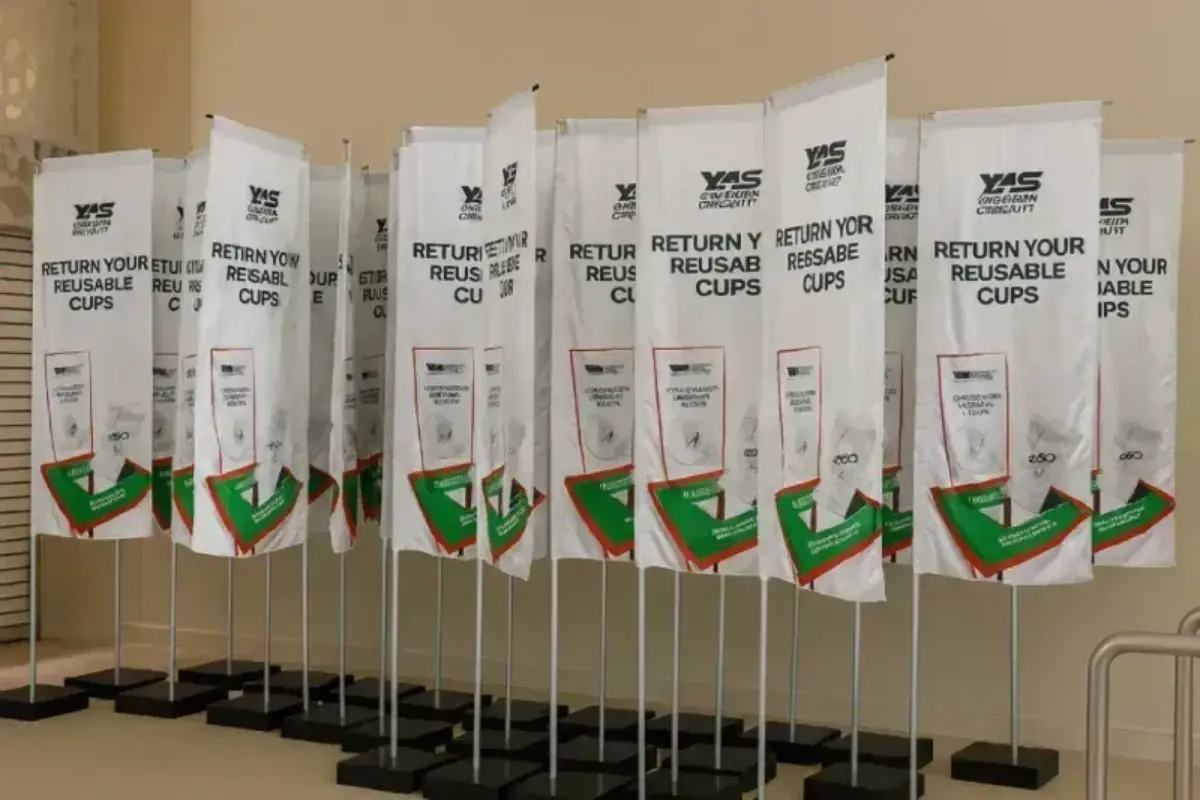 arge-scale L-shape flag rollout across multiple Abu Dhabi venues with rapid deployment coordination and concrete-weighted stability.