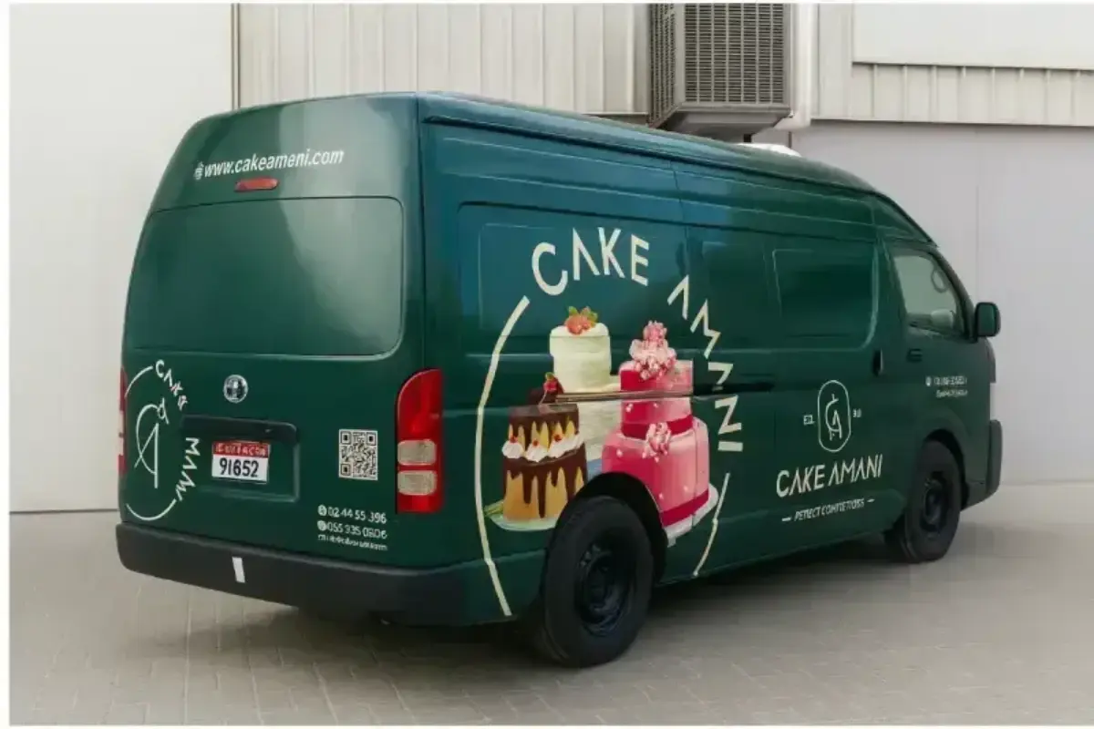 Toyota Hiace delivery van transformation with roof coverage delivering mobile bakery brand presence across distribution routes.