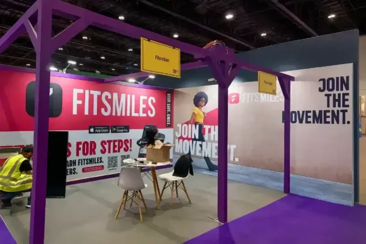 Exhibition wall graphics creating branded backdrop for dental industry activation and promotional booth presence at ADNEC venue.