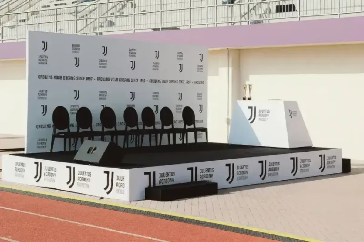 Custom fabricated stage with reinforced structure delivering branded presentation platform for sports academy events and ceremonies.