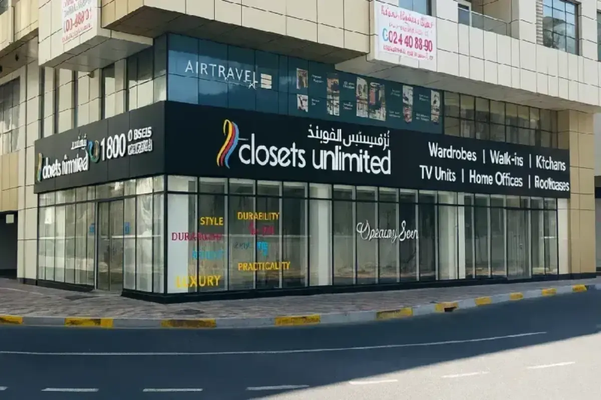 Large-scale corner storefront illumination system delivered for custom closet showroom, featuring dual-panel wraparound design with frontlit dimensional lettering for maximum street visibility.