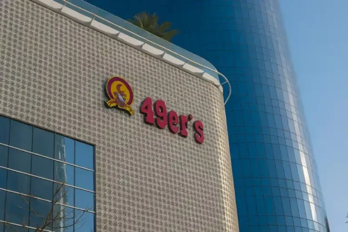 Building facade signage at 45-meter height including removal of existing sign and installation of new 3D letters on Al Reem Island restaurant.