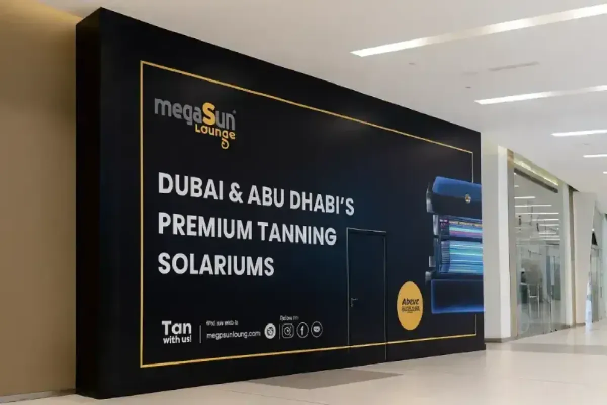 Large-format hoarding graphics providing construction barrier branding and visual screening for mall development project.