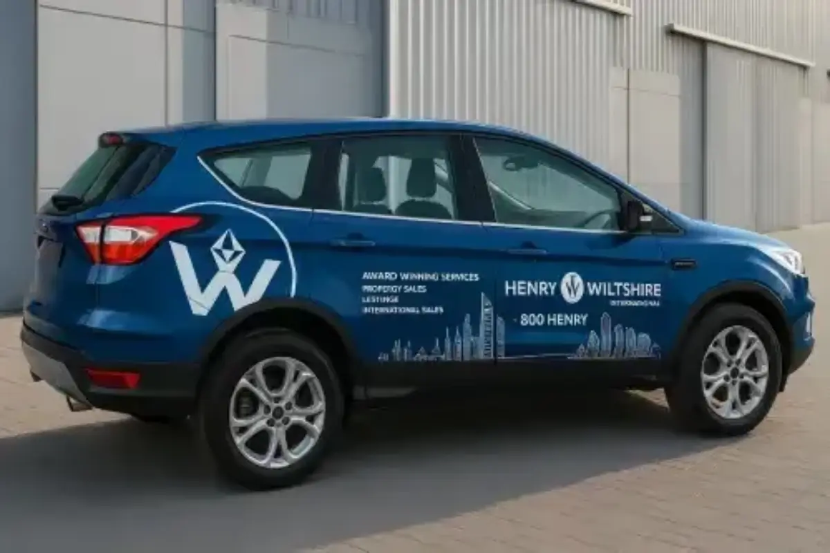 Fleet branding across 4 company vehicles with full wrap coverage and DED vehicle advertisement permit issuance for international real estate agency