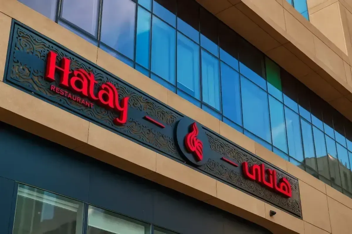 18-meter by 1-meter custom 15mm engraved metal backer panel with powder coating and 3D red acrylic letters for Turkish restaurant storefront.