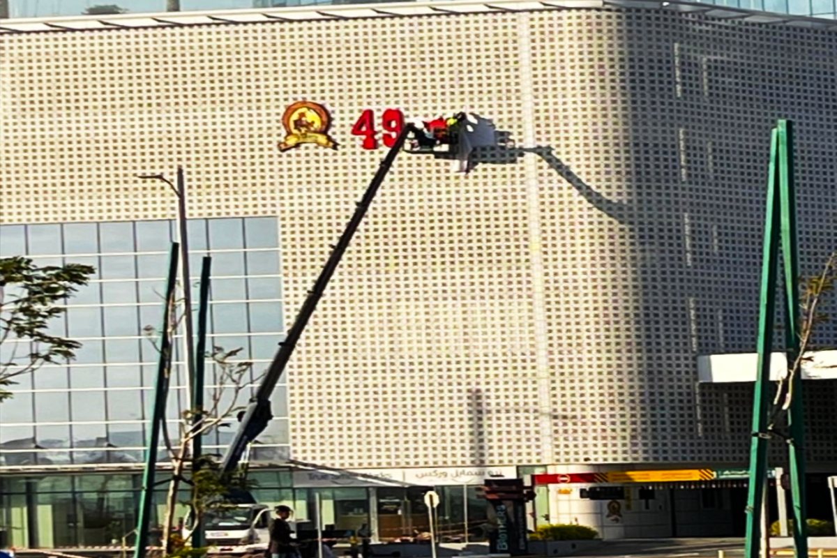 installation process of building facade signage in Al Reem Island by Ninety Nine Advertising