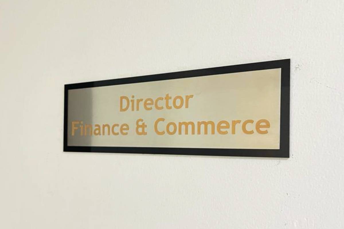 Interior door name metal sign by Ninety Nine Advertising