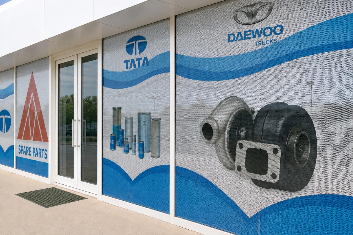 Tata & Daewoo Trucks One Way Vision Sticker branding on showroom windows in Musaffah, Abu Dhabi by Ninety Nine Advertising LLC.