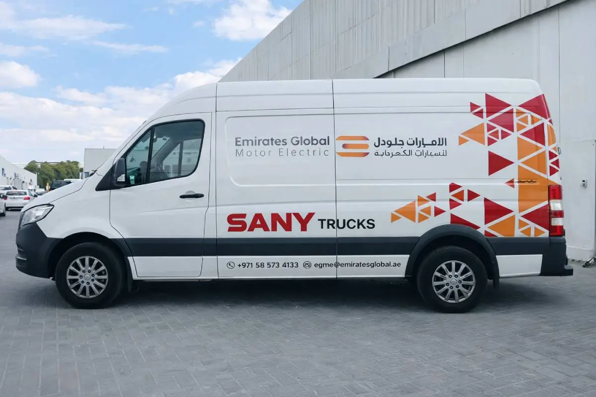 SANY Trucks & Emirates Global Partial Branding on a commercial van in Musaffah, Abu Dhabi by Ninety Nine Advertising LLC.