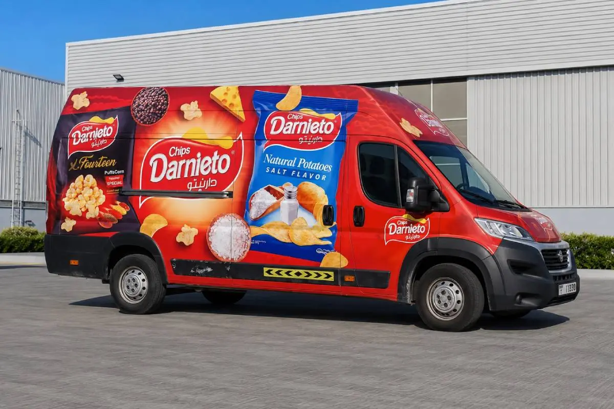 Darnieto full vehicle branding on a red delivery van in Abu Dhabi
