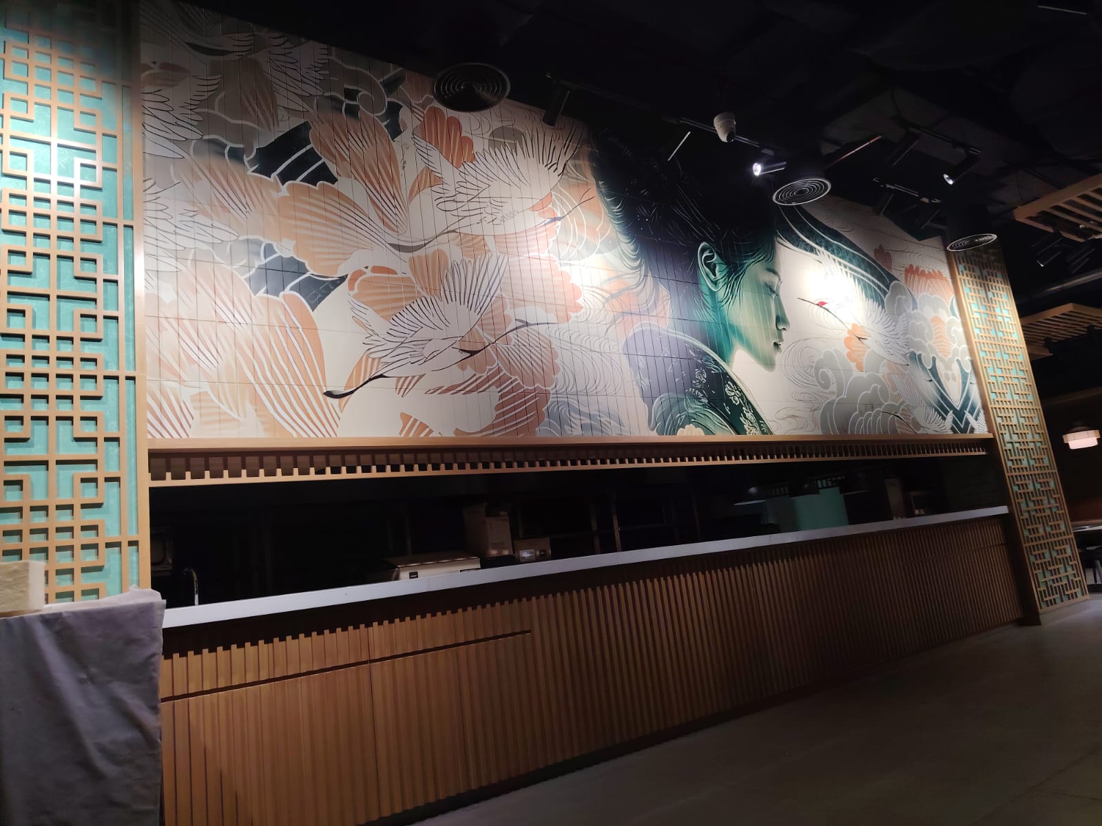Wide view of Golden Dragon's interior wall mural and service counter