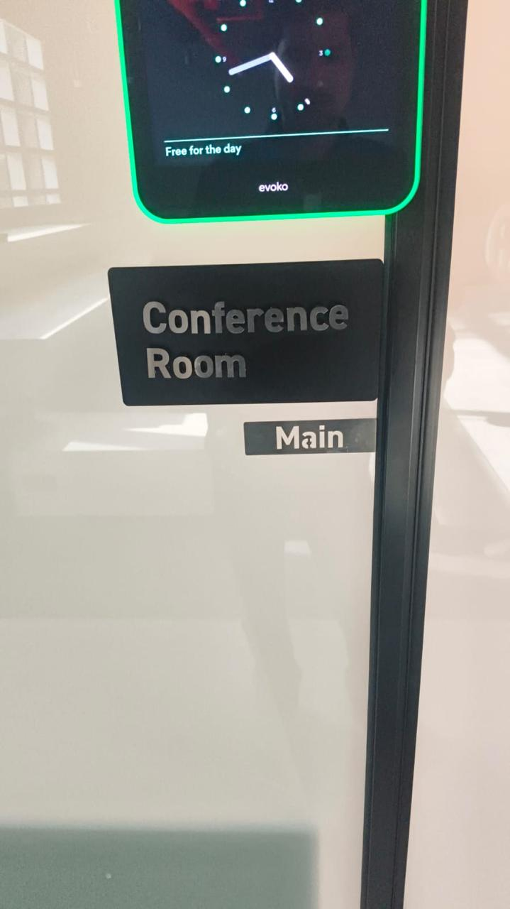 Conference room label beside an office doorway