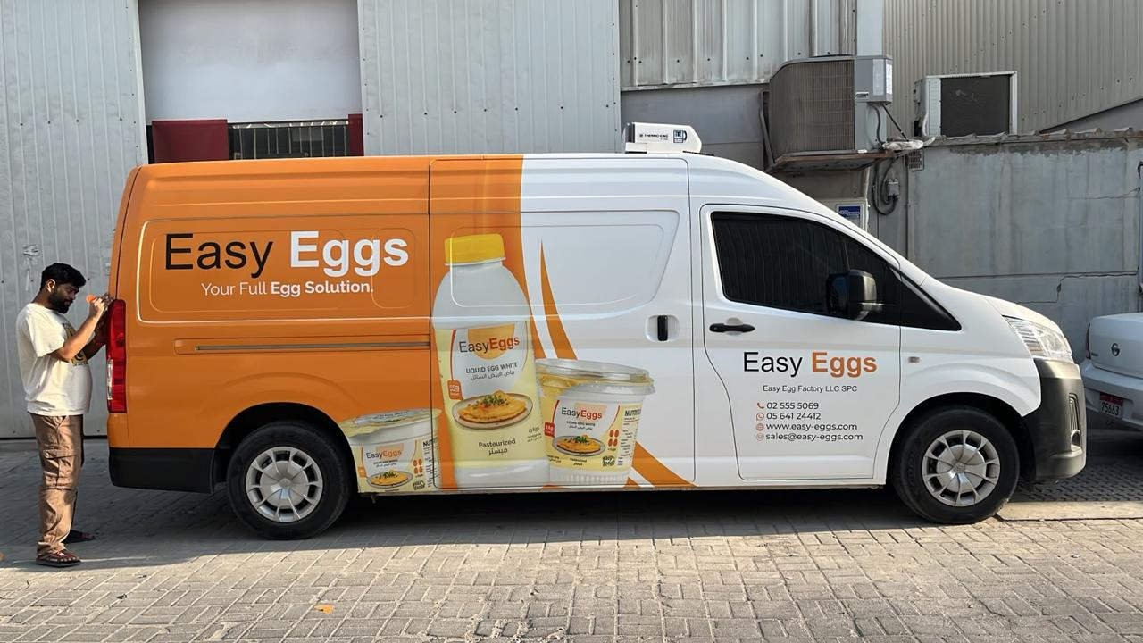 Opposite side of the Easy Eggs branded van with logo and egg product graphics