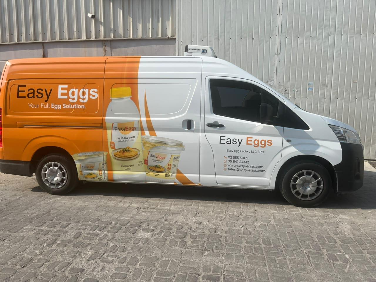 Easy Eggs logo product packs and contact details across a branded delivery van