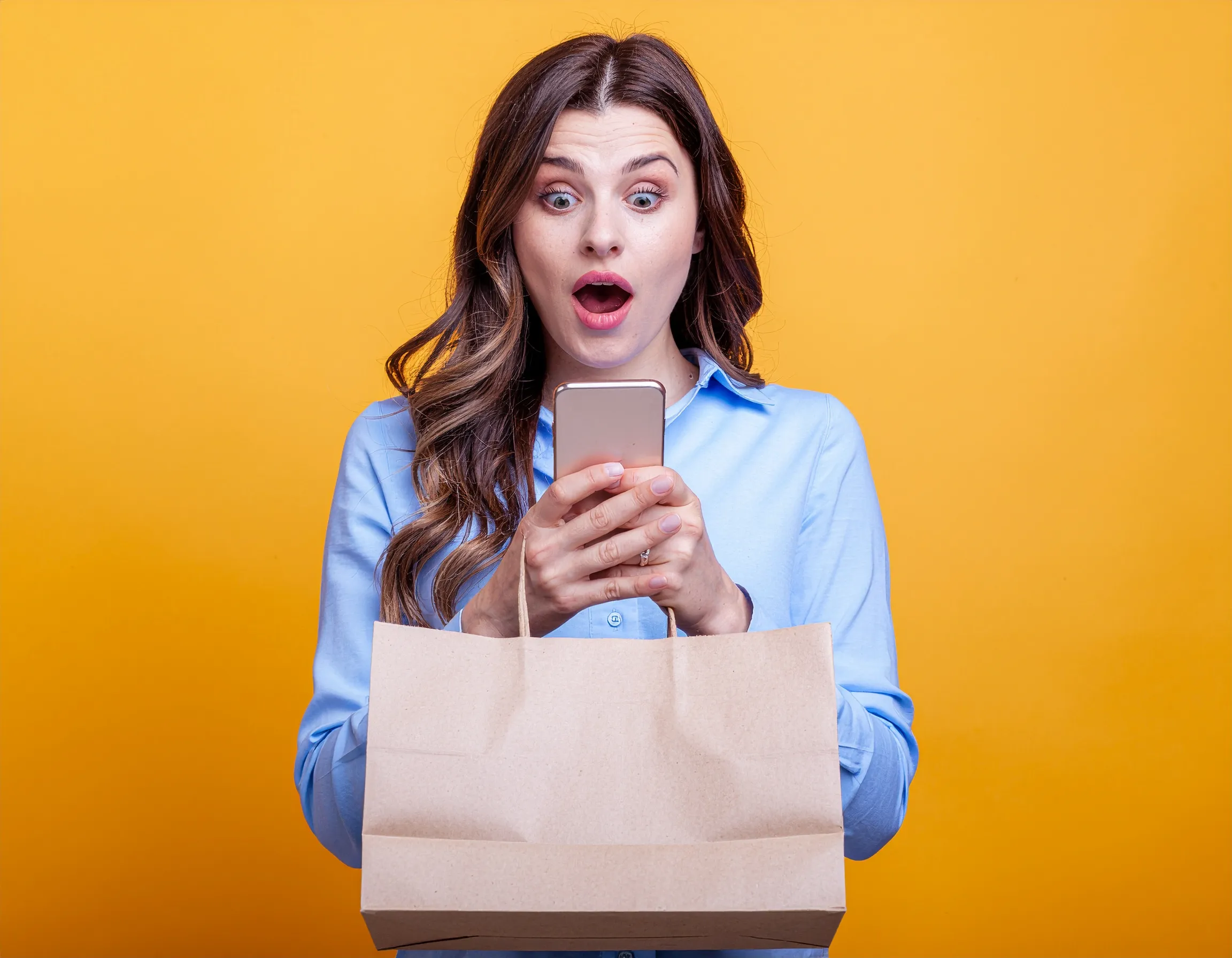 Picture of person looking shocked, holding a delivery bag.