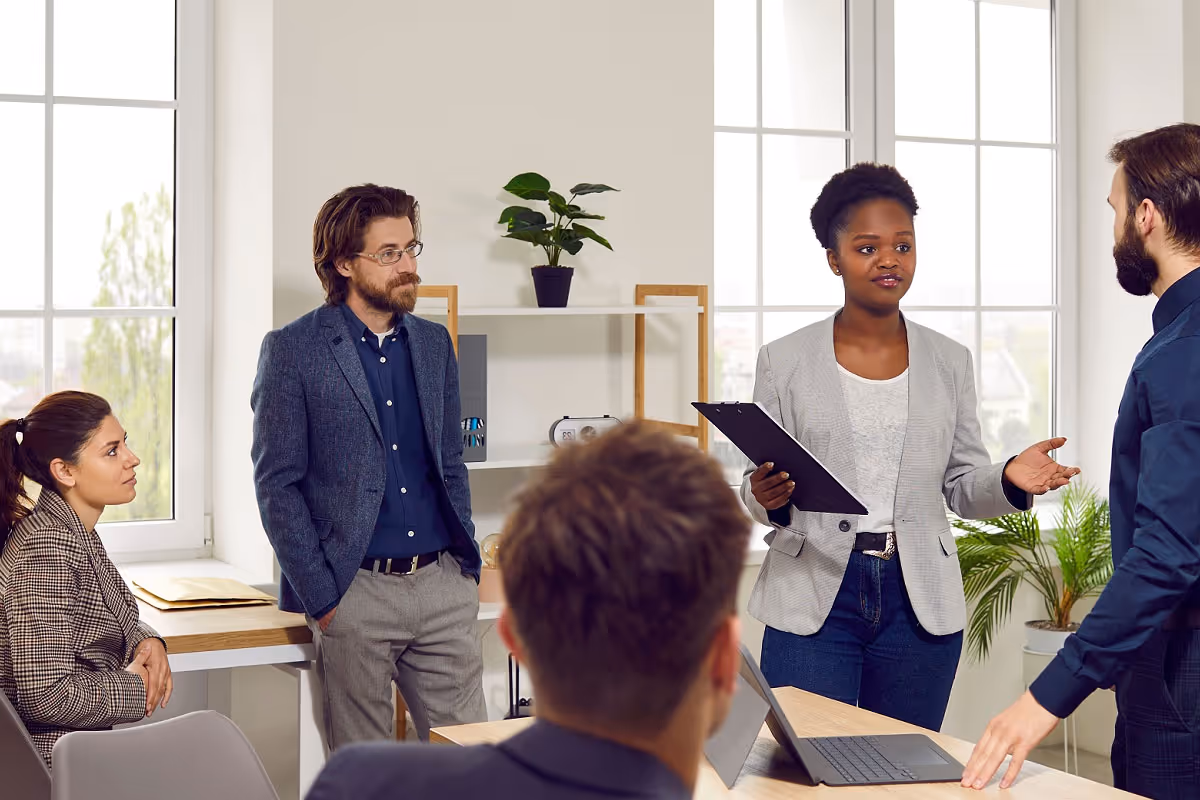 Coworkers in a meeting to discuss cultural integration initiatives