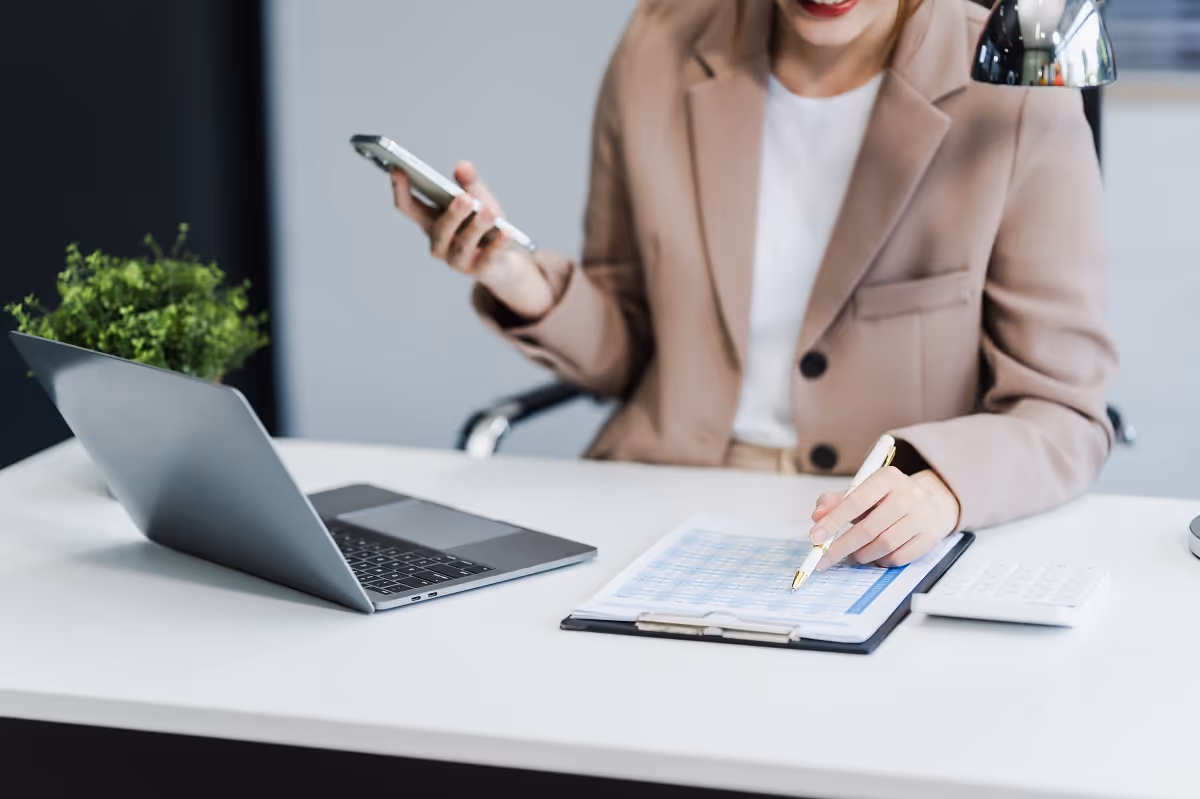 Professional reviewing documents for due diligence