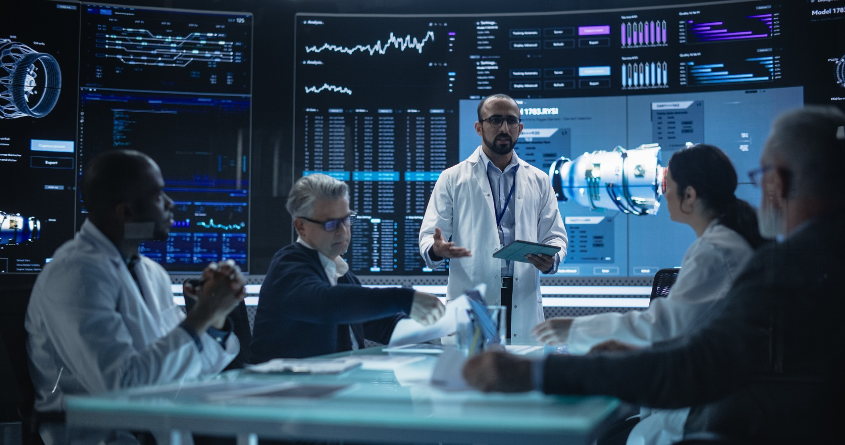 Executives and scientists meeting in a high-tech laboratory, analyzing advanced data and innovation performance
