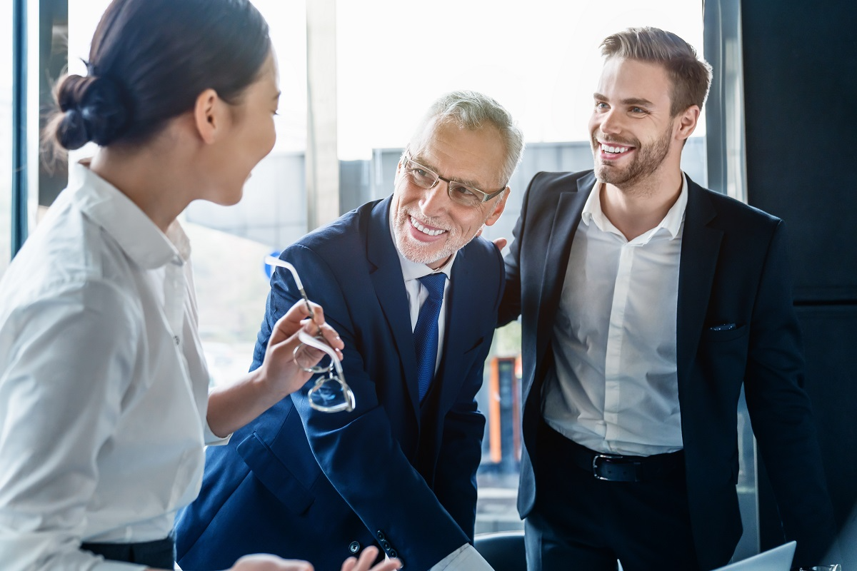 Financial advisors discussing an M&A transaction during a financial due diligence meeting