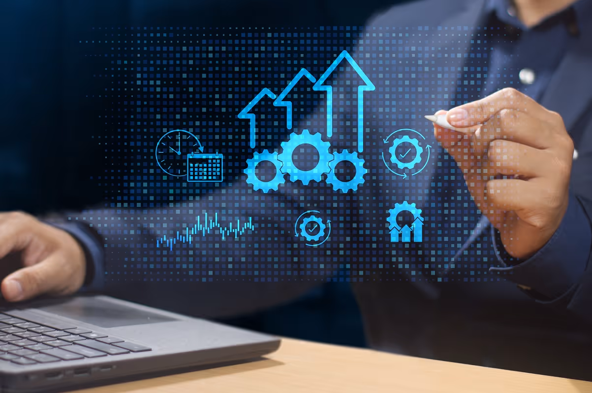 Business growth icons and upward arrows displayed over a laptop, representing value creation from M&A
