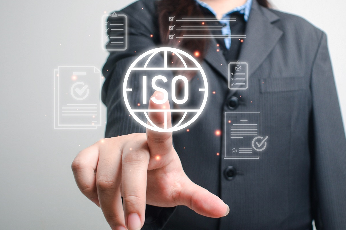 Business professional selecting ISO certification compliance on a virtual interface representing quality and regulatory standards