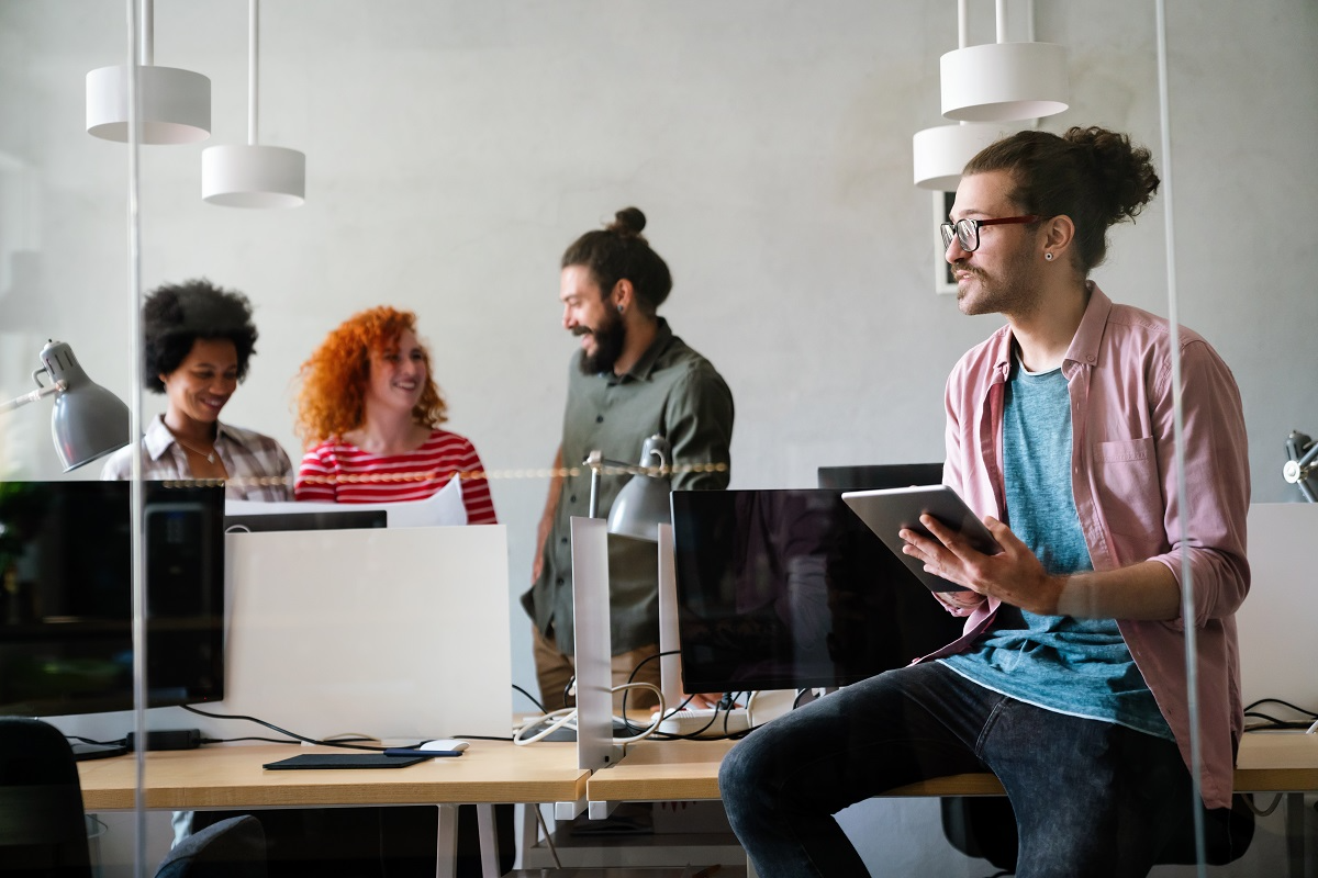 Private equity team collaborating on AI-driven deal analysis in office