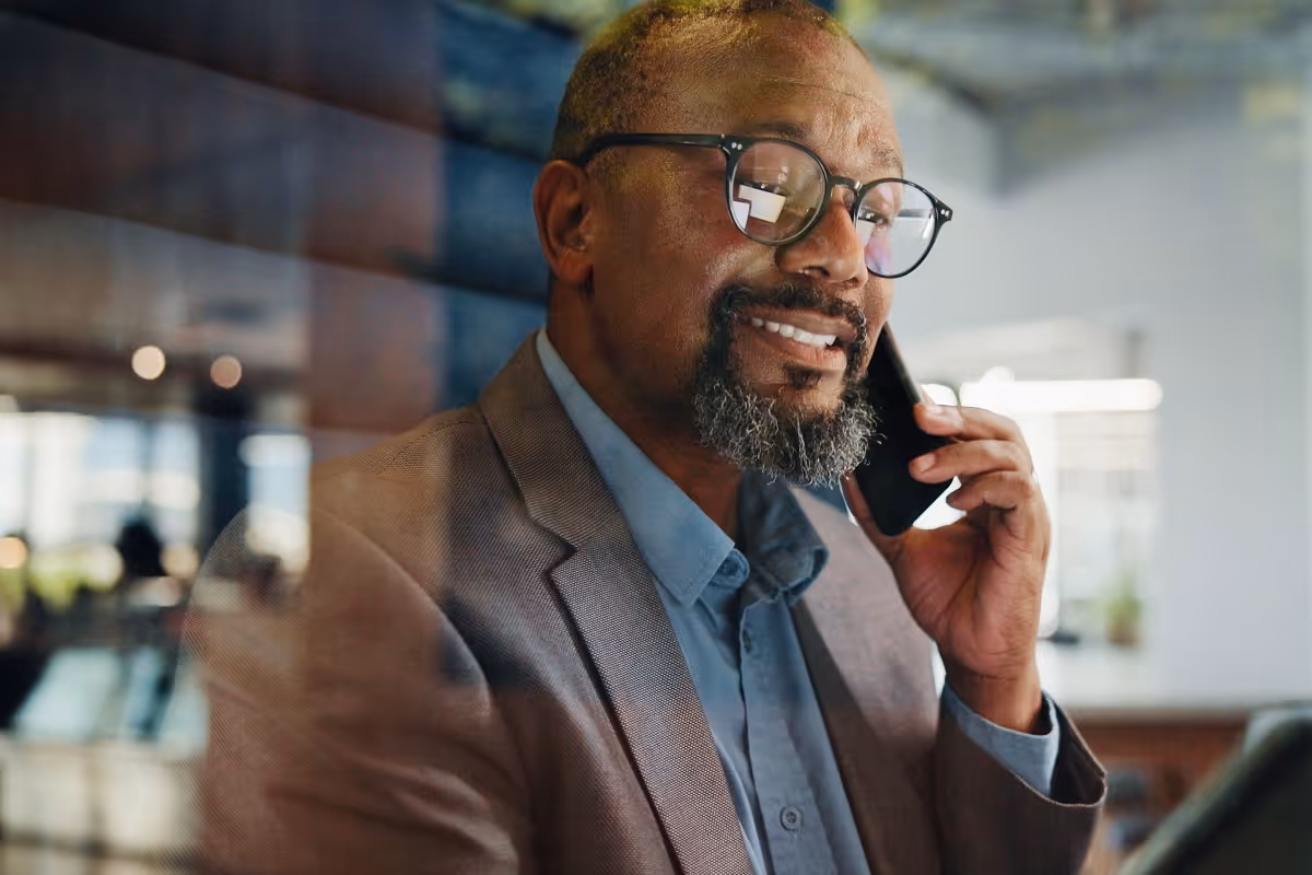 Private equity professional discussing deal strategy using AI tools