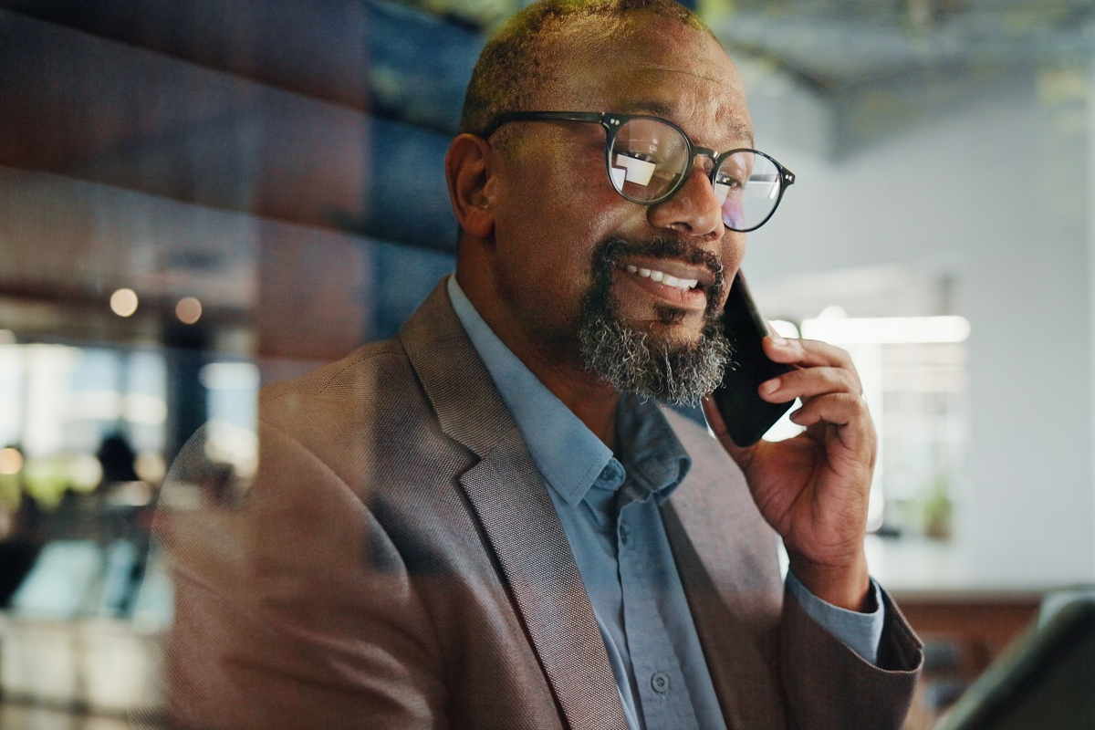 Private equity professional discussing deal strategy using AI tools