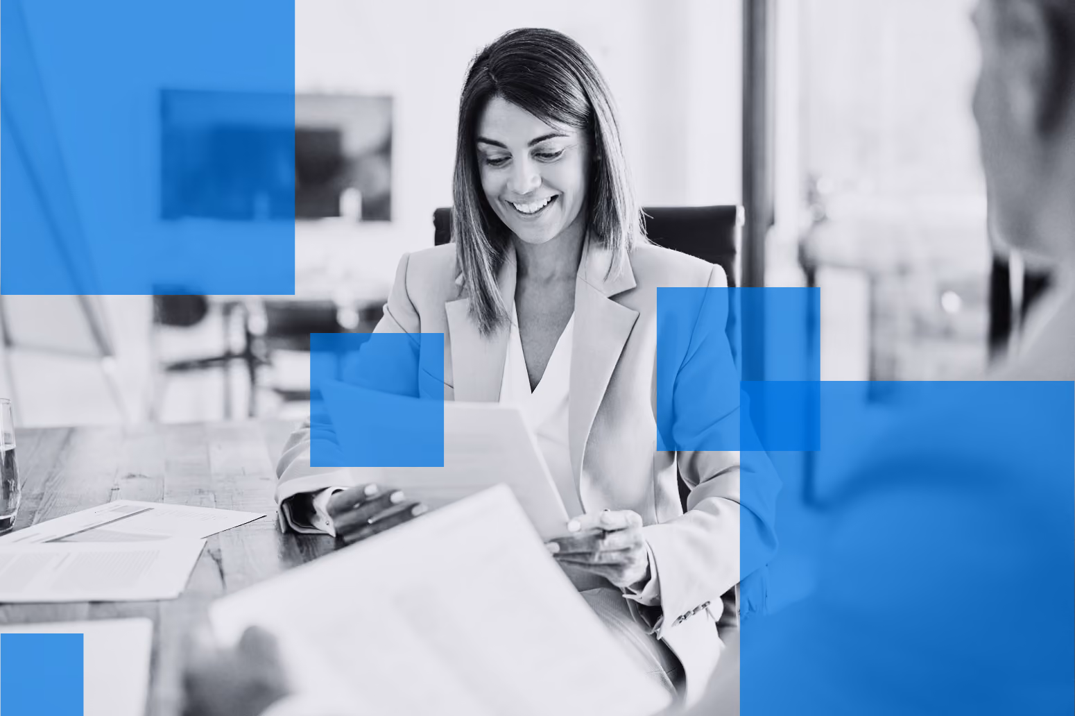 Business professionals reviewing financial documents during a discounted cash flow valuation meeting