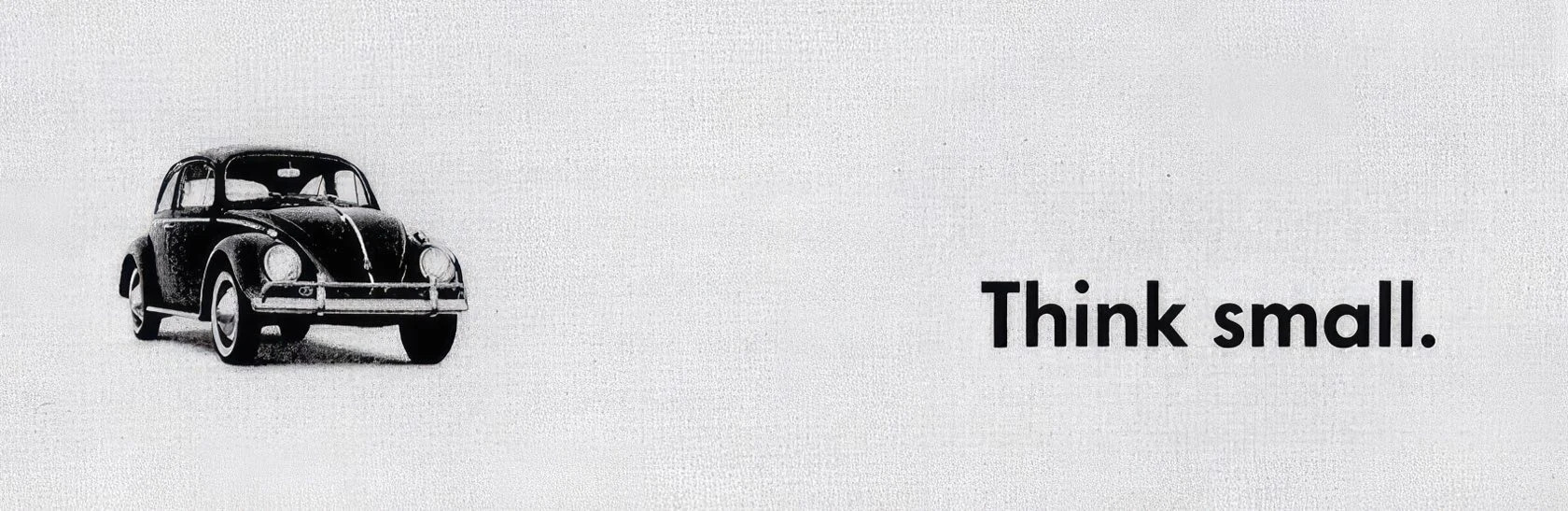 Publicité Volkswagen Think small avec une petite Coccinelle sur un fond clair.