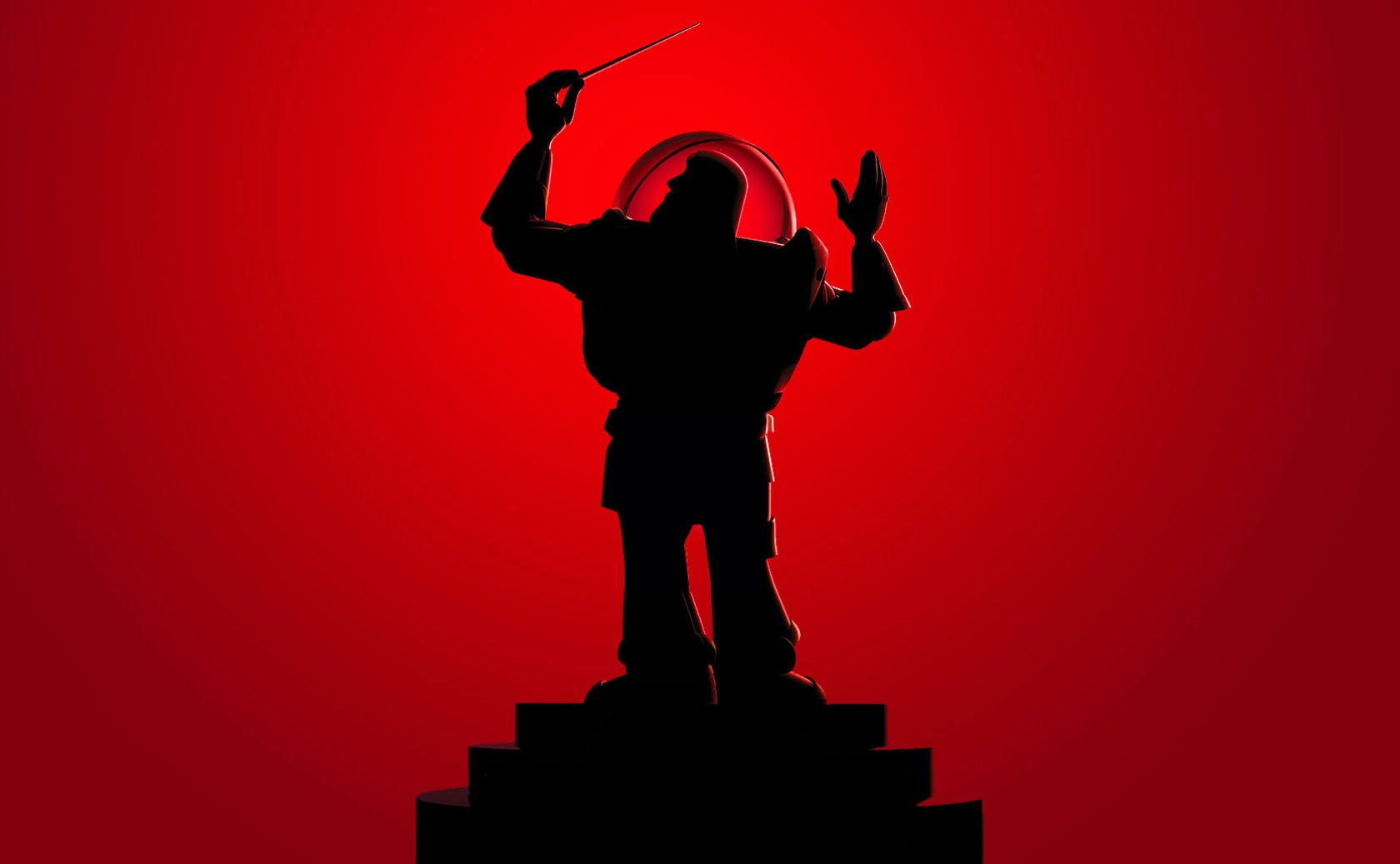 Silhouette d’un chef d’orchestre sur un fond rouge.