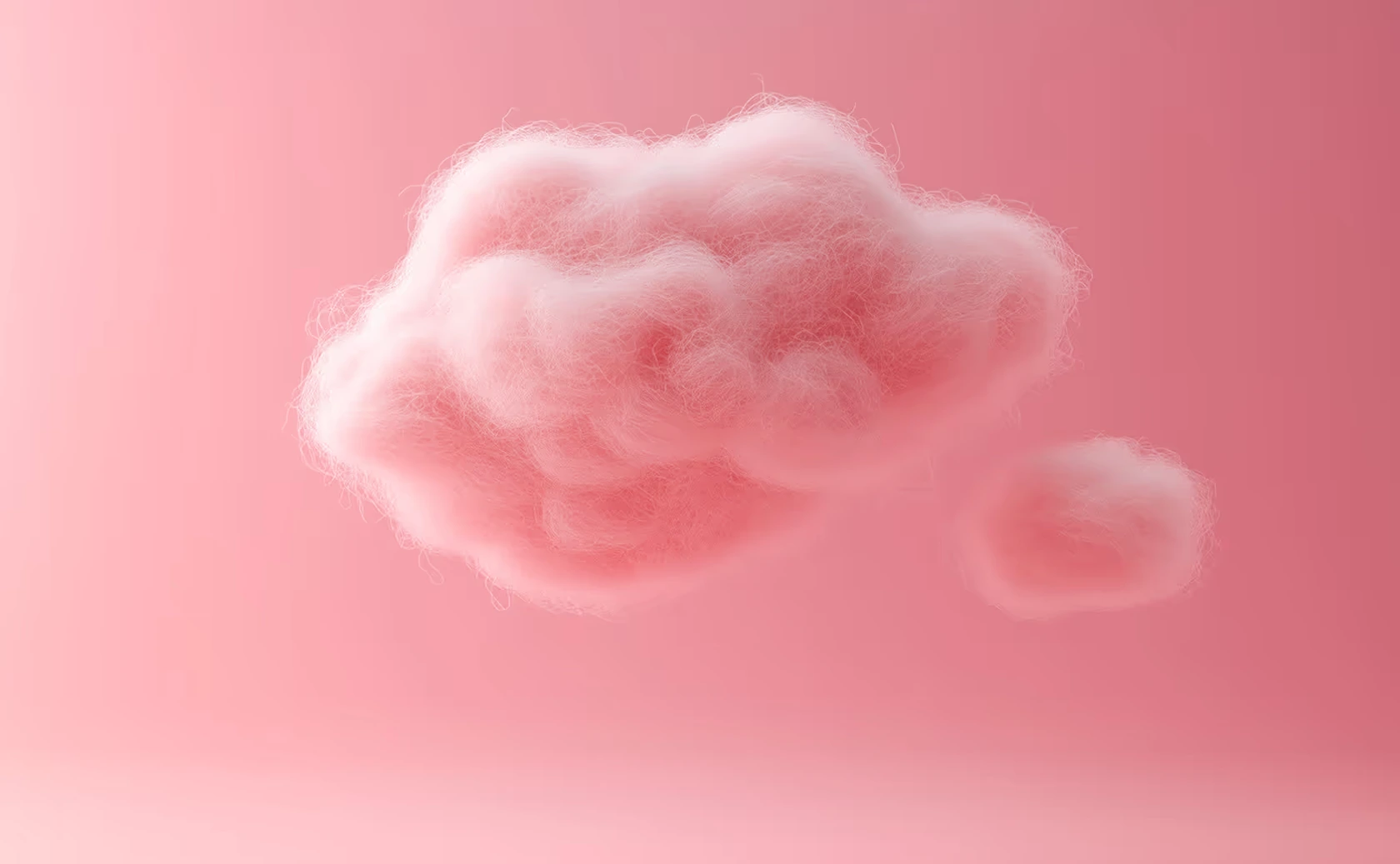 Nuages roses flous sur un fond rose.
