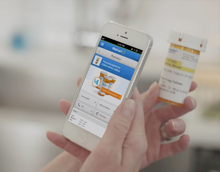 Person holding phone viewing Walmart app